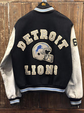 Load image into Gallery viewer, Detroit Lions Vintage 90s Chalk Line Varsity Jacket Black Cream Light Blue Collar (Damaged/Aged) ABC Vintage 